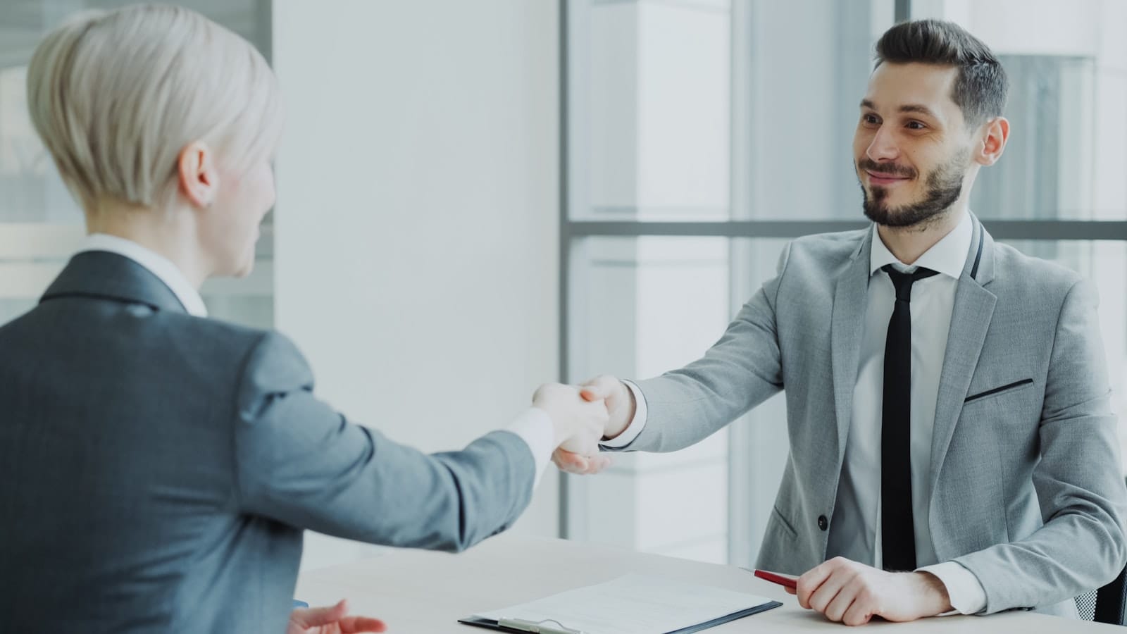 Lending specialist consultation and handshake — responsible, transparent lending at Stearn Lending